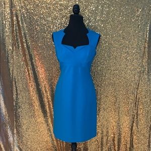 Turquoise sleeveless dress with dramatic neckline